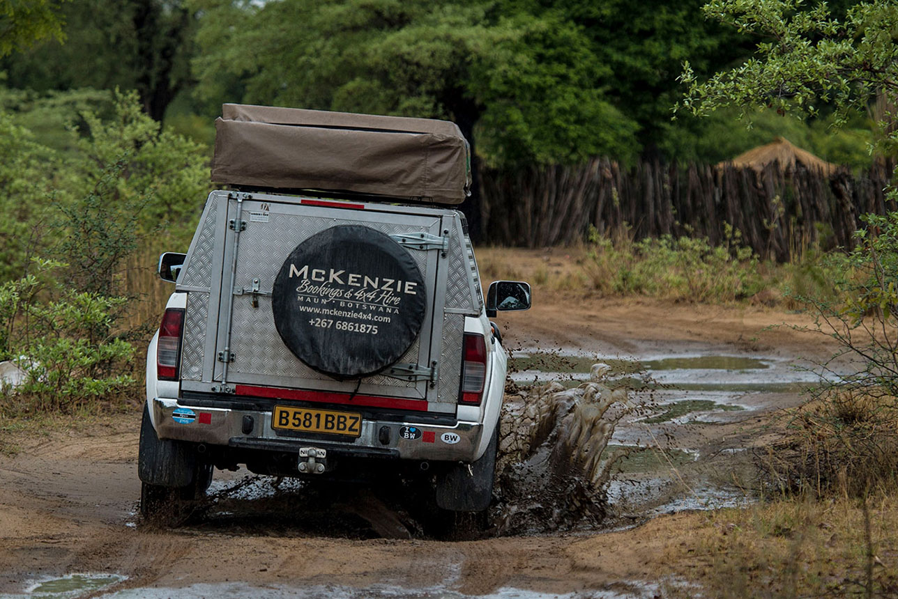 McKenzie 4x4 vehicle driving through the mud in Moremi Game Reserve
